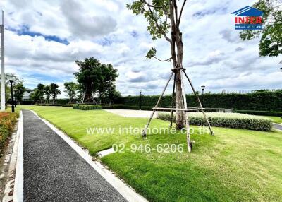 Outdoor landscaped garden with walking path and trees