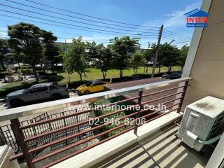 Balcony view with street and greenery