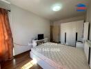 Bedroom with illuminated ceiling light, bed frame, and wardrobe