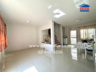 Spacious living room with stairs