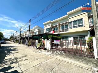 Exterior view of residential buildings with a clear blue sky