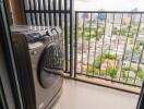 Balcony with washing machine and city view