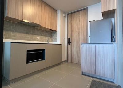 Modern kitchen with wooden cabinets and appliances