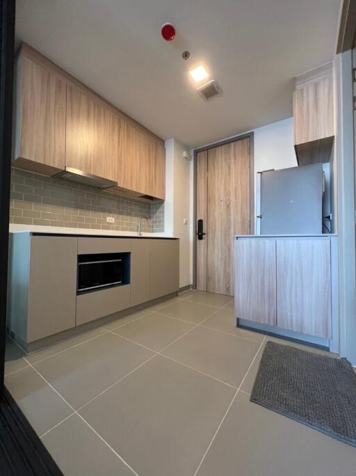 Modern kitchen with wooden cabinets and appliances