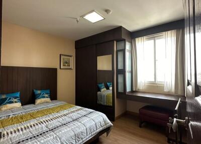 Spacious and well-lit bedroom with a double bed