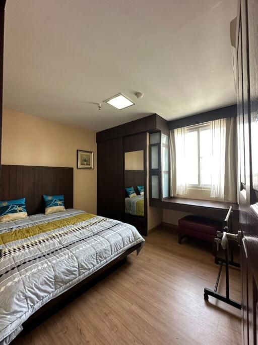 Spacious and well-lit bedroom with a double bed