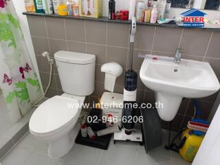 Small bathroom with shower, toilet, and sink