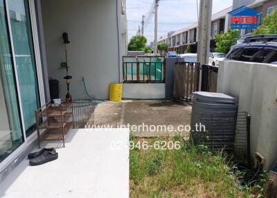 Outdoor space with grass and concrete patio