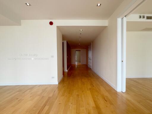 Spacious living area with wooden flooring