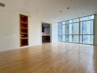 Spacious living area with large windows and natural light