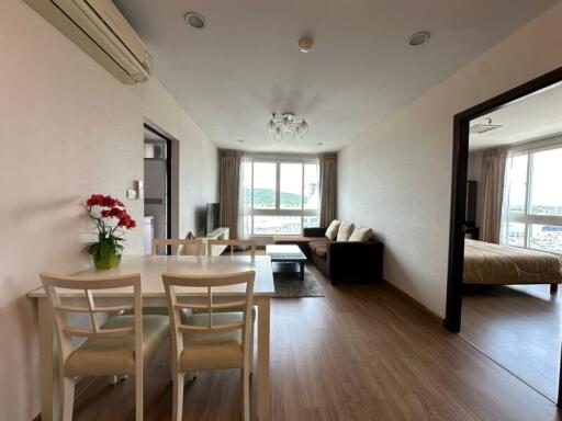 Well-lit living room with dining area