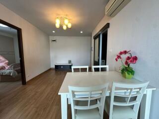 Main living space with dining table and modern lighting