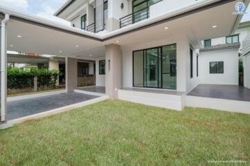 Modern house with large windows and covered outdoor space