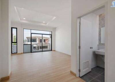 Bright and spacious living area with adjacent bathroom