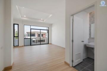 Bright and spacious living area with adjacent bathroom