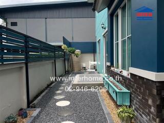 Exterior walkway with garden