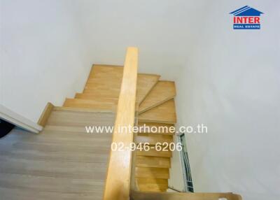 Wooden staircase with guard rail