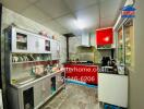 Modern kitchen with stainless steel cabinets and black countertops