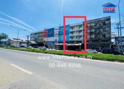 Street view of a row of commercial buildings