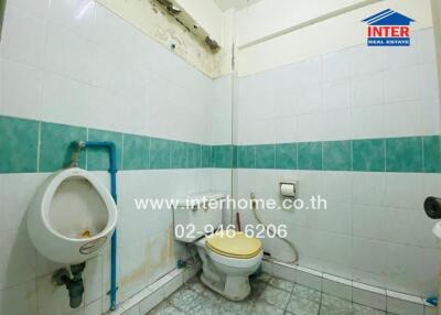 Bathroom with toilet and urinal