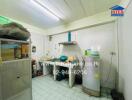 A view of the kitchen area with appliances and storage space