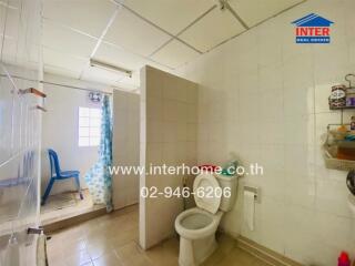 Bathroom with toilet and shower area