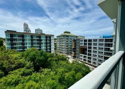 Balcony view of surrounding buildings and greenery