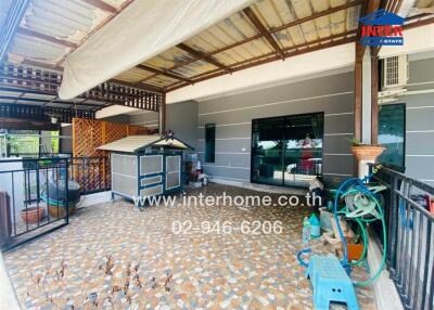 Covered balcony with tiled flooring