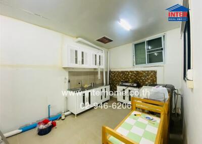 White kitchen with cabinets and a dining table