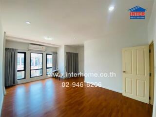 Spacious living room with hardwood floors