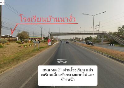 Main road near a school with pedestrian bridge