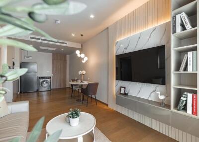 Modern living area with dining section and wall-mounted TV
