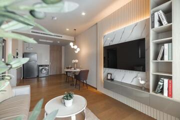 Modern living area with dining section and wall-mounted TV