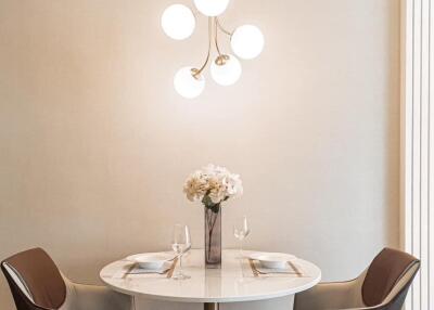 Modern dining area with a round table and plush chairs