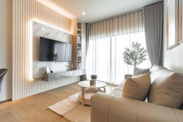 Modern living room with TV and natural light