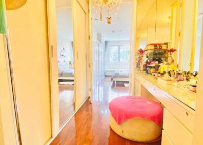 bright bedroom with chandelier and makeup vanity