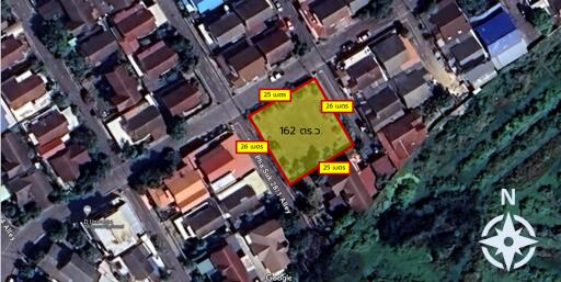 Aerial view of a plot of land marked with boundaries and area information