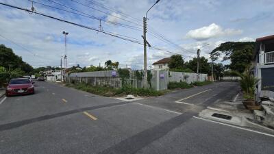 A view of a street intersection in a residential neighborhood