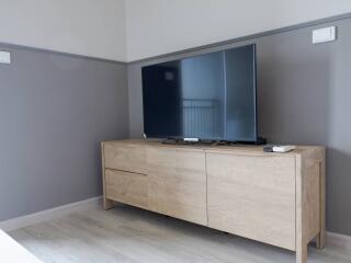 Modern living room with wooden TV stand