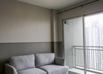 Modern minimalist living room with a balcony
