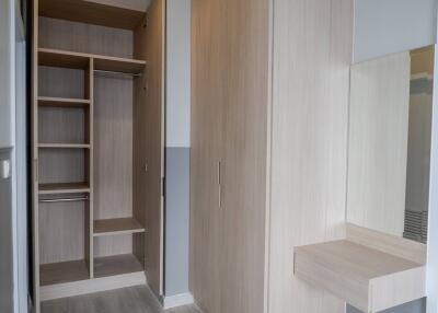 Bedroom with built-in wardrobe and vanity area