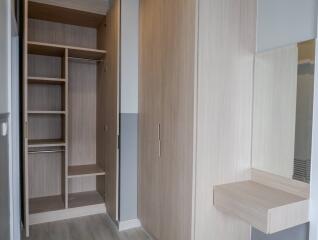 Bedroom with built-in wardrobe and vanity area