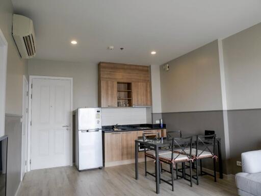 Compact kitchen and dining area with modern appliances