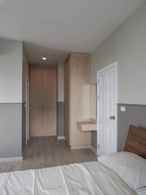 Cozy bedroom with wooden furniture and neutral tones