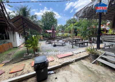 Outdoor area with seating and greenery