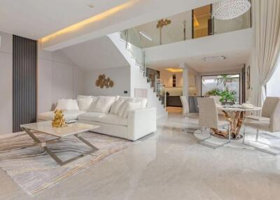 Spacious modern living room with open dining area and mezzanine