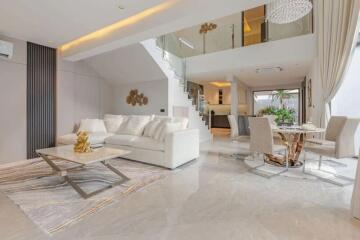 Spacious modern living room with open dining area and mezzanine