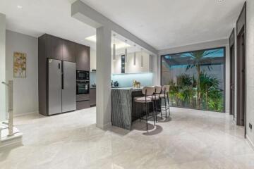 Modern kitchen with island and bar stools