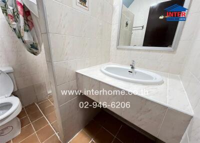 Clean and well-maintained bathroom with a sink and toilet