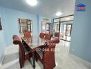 Dining room with a glass-top table and wicker chairs